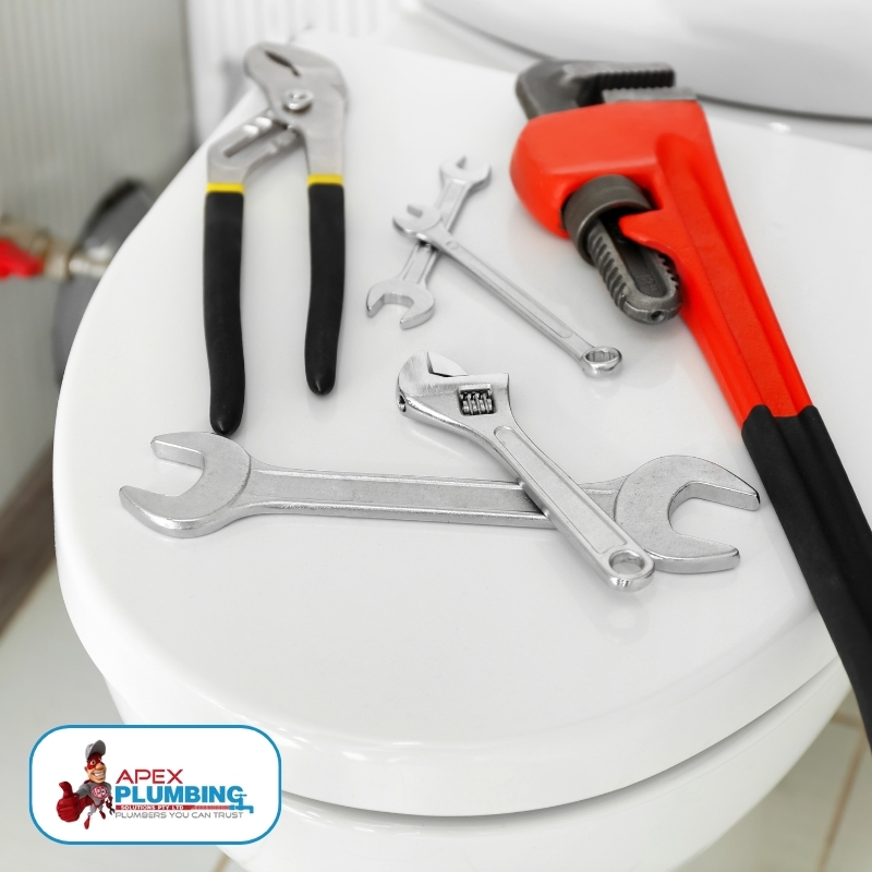 Expert plumber showcasing advanced plumbing tools used for efficient toilet repairs, demonstrating professionalism and expertise in Sydney's premiere toilet repair services.