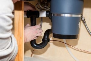 Image presents How can you troubleshoot a humming garbage disposal