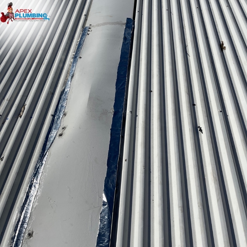 Hole in a damaged roof in need of Apex Plumbing Service's leaking roof repairs Sydney Wide.